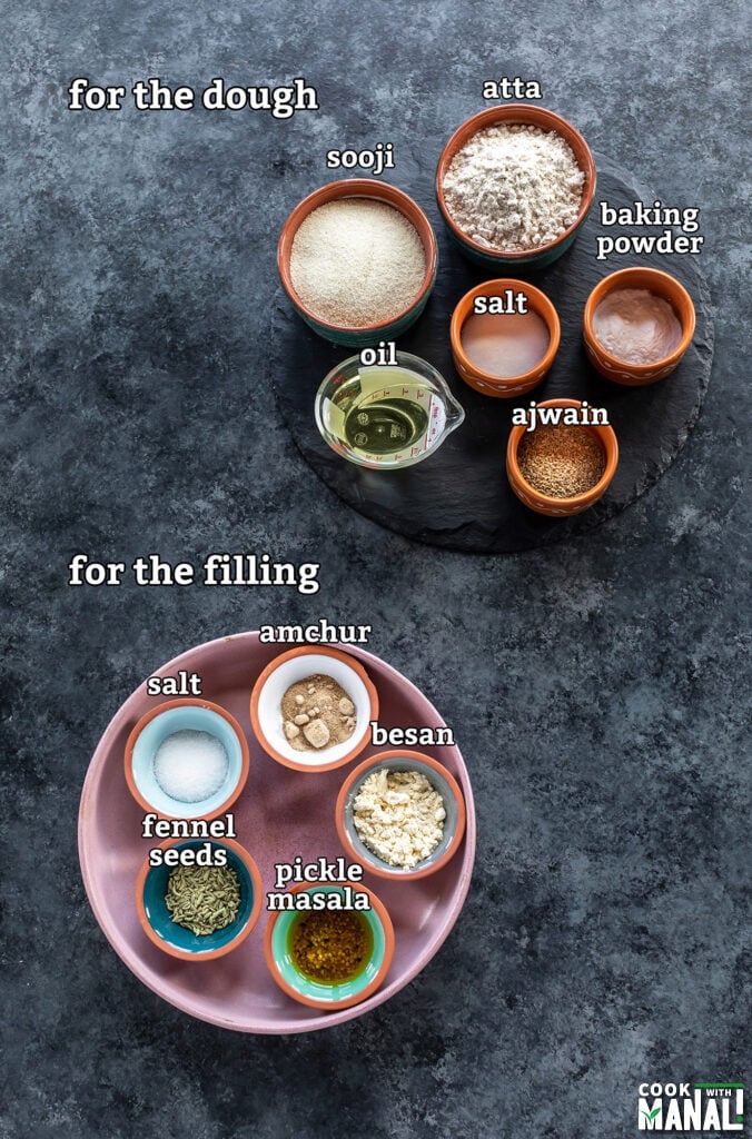 ingredients for Achari mathri arranged on a board