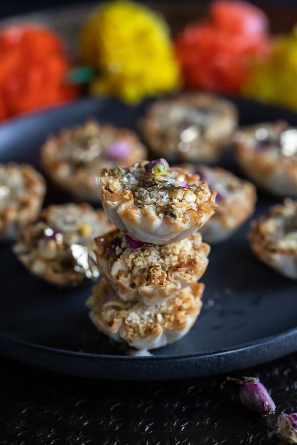 stack of phyllo cups garnished with dried rose petals