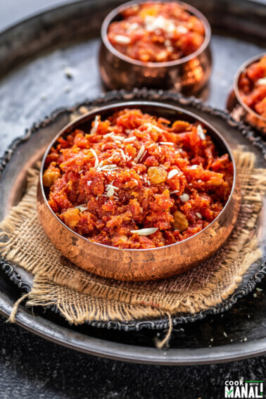 gajar halwa served in a copper bowl