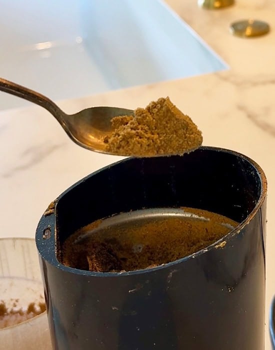 a spoon showing ground spices