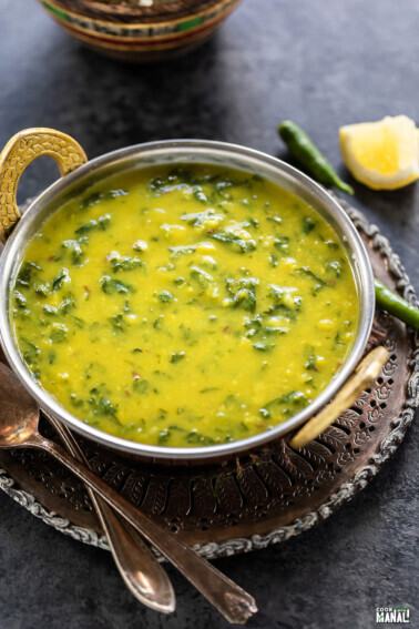 spinach dal served in a copper kadai