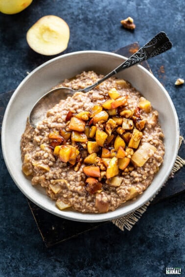 oatmeal topped with caramelized apples served in a bowl