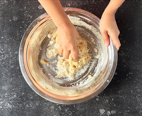 kneading the dough in a wide plate
