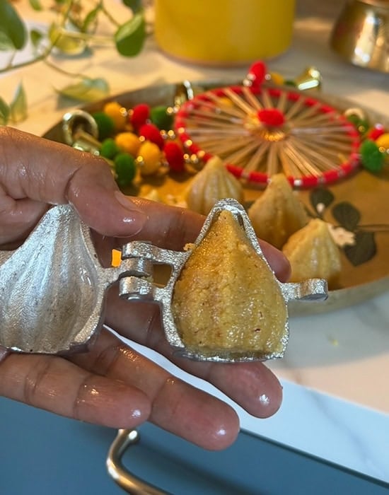 a modak mold showcasing modak inside