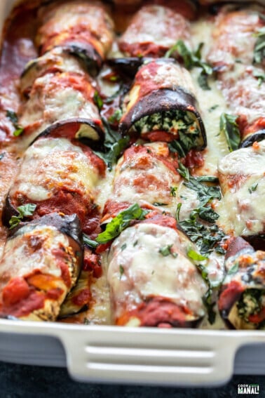 paneer eggplant rolls garnished with fresh basil