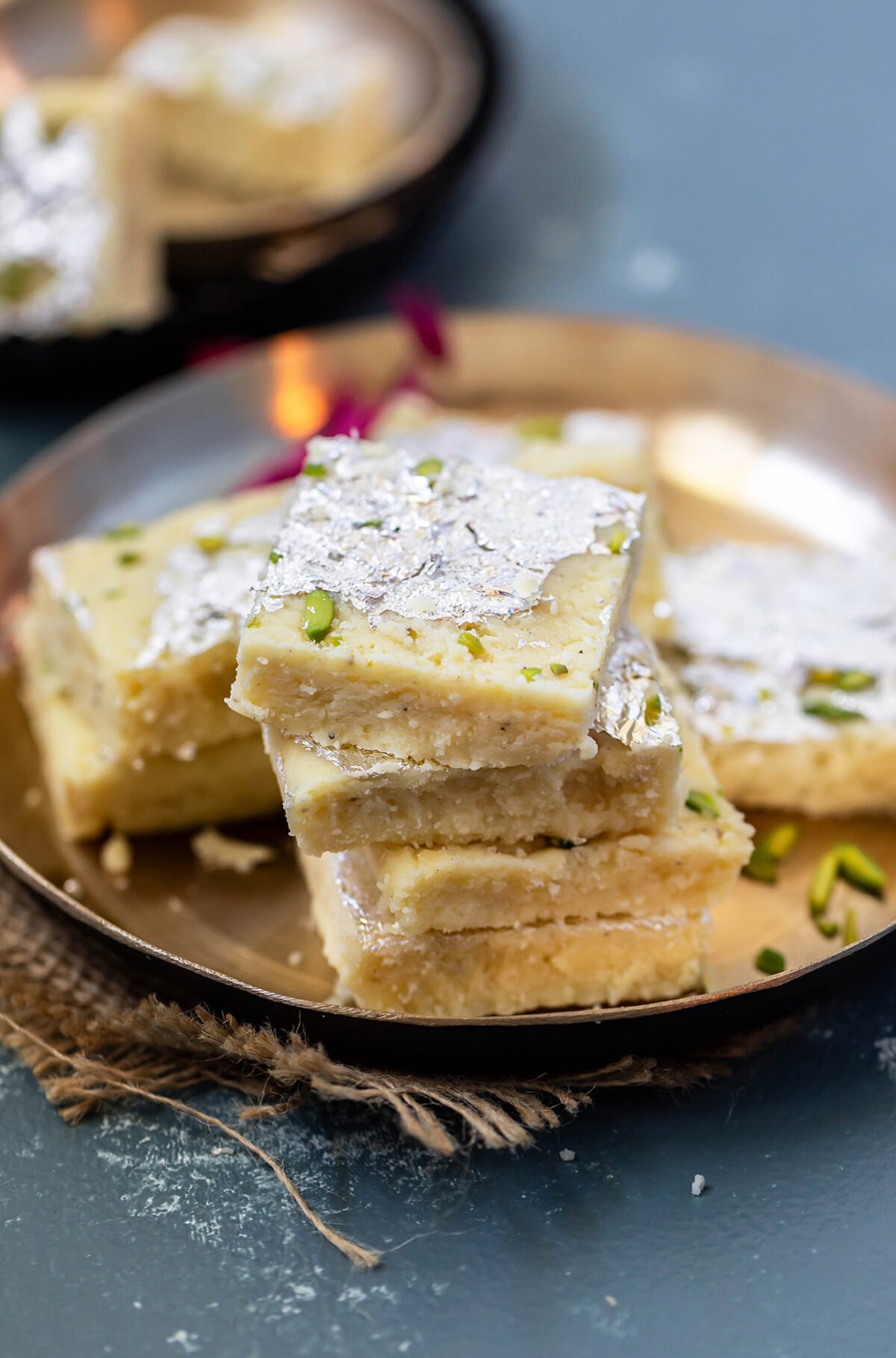 stack of 3 plain milk burfi with more in the back