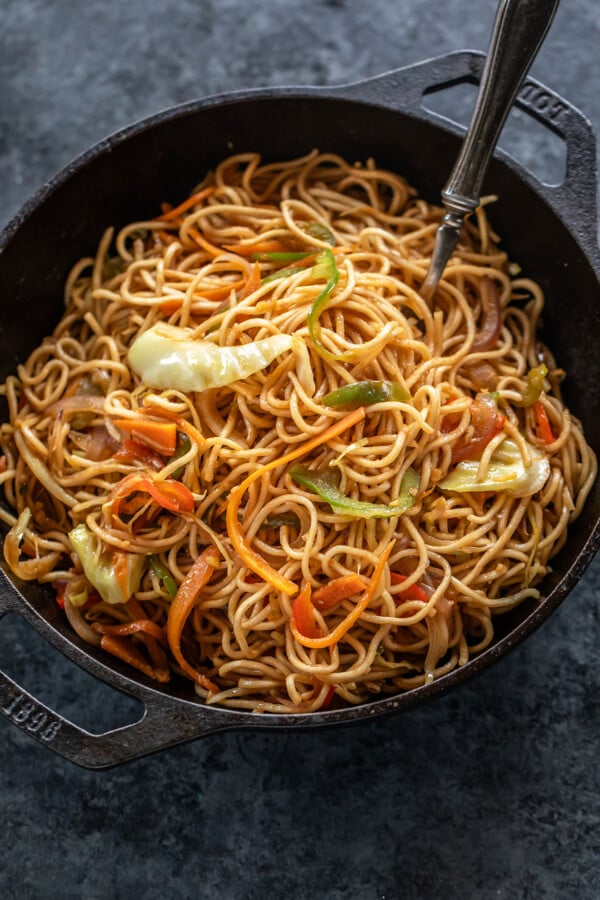 veg chowmein served in a small black iron wok
