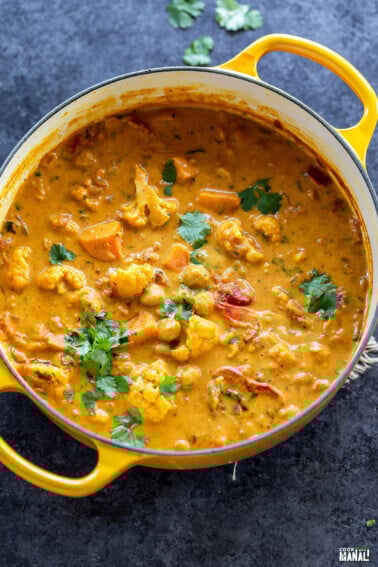 pot of curry garnished with cilantro