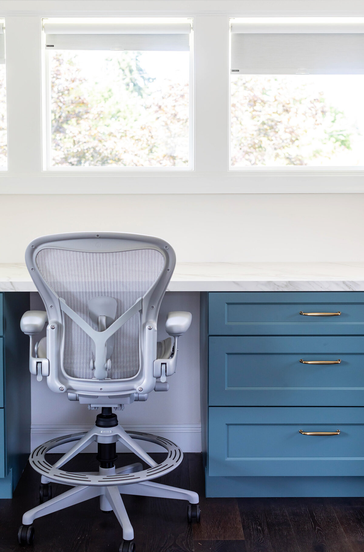 a marble desk area with chair